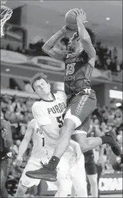  ?? Mic Smith Associated Press ?? VIRGINIA TECH’S Ahmed Hill, right, is fouled by Purdue’s Sasha Stefanovic during the second half.