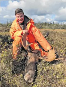  ??  ?? Ian Brazil with his first ever moose. - Paul Smith photo