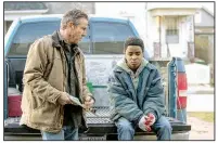  ??  ?? Hal (Dennis Quaid) adopts a tough love approach to dealing with his adopted son Eli (newcomer Myles Truitt) in the genre-blending sci-fi film Kin.