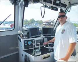  ?? STAFF PHOTOS BY JOHN WHARTON ?? Wes Jackson stands at the controls of a 32-foot fire and rescue boat, as the lieutenant of boat operations with Cobb Island Volunteer Fire Department and Emergency Medical Services.