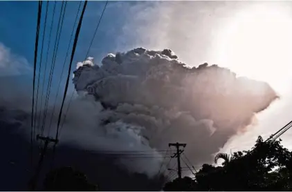  ?? KEPA DIEZ ARA/AP ?? Ash rises into the air as La Soufriere volcano erupts on the eastern Caribbean island of St. Vincent on Friday.