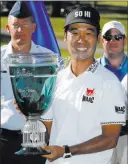  ?? Steve Helber ?? The Associated Press Las Vegas resident Kevin Na is all smiles after winning A Military Tribute at The Greenbrier on Sunday at White Sulphur Springs, W.VA. — his first tour victory since 2011.