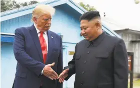  ?? Susan Walsh / Associated Press 2019 ?? President Trump and North Korea’s Kim Jong Un at the Korean border in 2019.