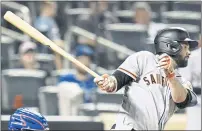  ?? FRANK FRANKLIN II — THE ASSOCIATED PRESS ?? The Giants’ Brandon Belt watches his RBI single during the eighth inning against the New York Mets on Tuesday night in New York.