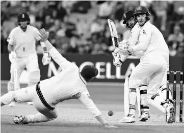  ??  ?? England’s James Vince (right) hits a shot past Australia’s David Warner during the fourth day of the second Ashes cricket test match at Adelaide Oval in Adelaide, Australia in this Dec 5 file photo. — Reuters photo