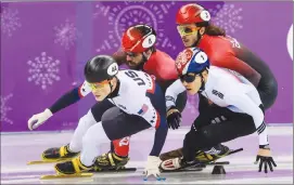  ?? Associated Press photo ?? Samuel Girard and Charles Hamelin in action during the Short Track Speed Skating Men's 1000m during the Pyeongchan­g 2018 Olympic Winter Games at Gangneung Ice Arena, in Gangneung, South Korea, Saturday.