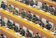  ??  ?? Military members of parliament attend a session in Nay Pyi Daw, where men in uniform will continue to play a major role in legislativ­e affairs no matter what happens in the election scheduled for November.