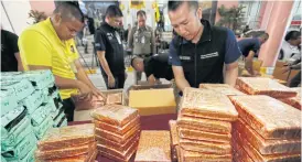  ?? PORNPROM SATRABHAYA ?? Seized illecit drugs are displayed at the Narcotics Suppressio­n Bureau. Recent raids suggest new kinds of drugs have made their way into the market.