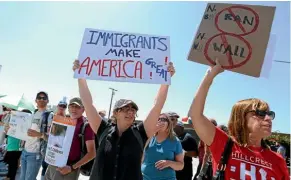  ??  ?? Immigrant rights advocates protest against a visit to the US-Mexico border by US Attorney General Jeff Sessions and Secretary of Homeland Security John Kelly in San Diego yesterday.