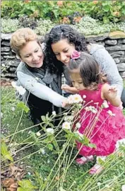  ??  ?? KATRINA MARTIR with her wife, Marianne McAdam, left, and their daughter. Martir said she lost her job in 2010 because of her sexual orientatio­n.