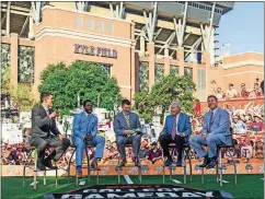  ?? [SAM CRAFT/THE ASSOCIATED PRESS] ?? ESPN’s College GameDay crew sits on set Sept. 8 in front of Kyle Field in College Station, Texas, before the start of a game between Clemson and Texas A&amp;M.