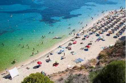  ??  ?? Spain. — Reuters
Place in the sun: People sunbathing in Portals Nous beach, amid the Covid-19 outbreak in Palma de Mallorca,