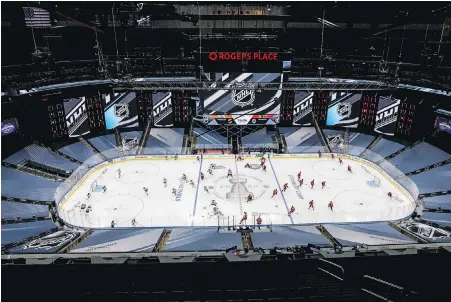  ??  ?? Rogers Place in Edmonton, with banners covering the lower-bowl seats, is ready for the resumption of NHL hockey.