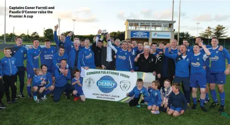  ??  ?? Captains Conor Farrell and Paudie O’Connor raise the Premier A cup