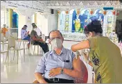  ??  ?? A senior citizen being inoculated at Swami Narayan Temple Vaccinatio­n Centre, Mahalaxmi, on Thursday.