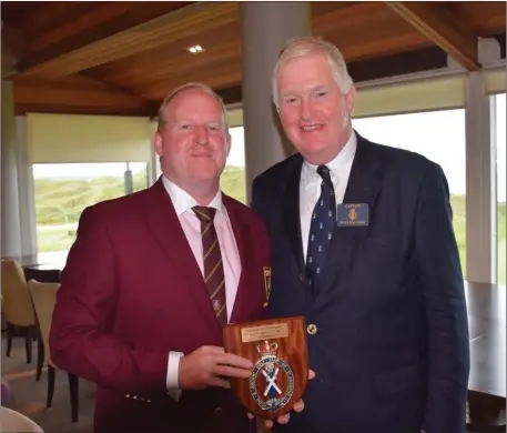  ??  ?? Ballybunio­n GC Men’s Captain Tom Keane makes a presentati­on to Keith Macintosh, Captain of the Royal and Ancient Golf Club of St Andrews, who was in attendance at the Jacques Leglise Trophy at the north Kerry club’s Old course last weekend