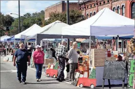  ??  ?? Arts and crafts vendors are set up in the Cotton Block for Fiddlin’ Fest on Saturday. / Doug Walker