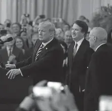  ?? MANUEL BALCE CENETA / AP ?? VICTORY MARCH: President Trump, Justice Brett Kavanaugh and retired Justice Anthony Kennedy enter the East Room of the White House for Kavanaugh’s swearing-in ceremony Monday.
