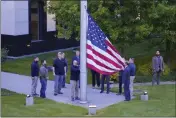  ?? EFREM LUKATSKY — THE ASSOCIATED PRESS ?? Employees raise the U.S. national flag at the U.S. embassy in Kyiv, Ukraine, on Wednesday.