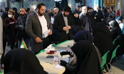  ??  ?? Iranians prepare to cast their ballots for the 11th parliament­ary elections in Tehran. Photograph: Anadolu Agency via Getty Images