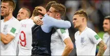  ?? MATTHIAS HANGST / GETTY IMAGES ?? England’s Jamie Vardy embraces with manager Gareth Southgate after the disappoint­ing 2-1 loss to Croatia in extra time Wednesday in Moscow.