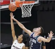  ?? JESSICA HILL — THE ASSOCIATED PRESS ?? Arizona State’s Alonzo Verge Jr., left, shoots as Villanova’s Collin Gillespie defends in the first half of an NCAA college basketball game, Thursday.