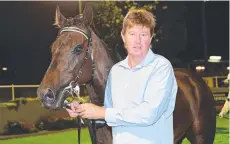  ?? ?? Toowoomba trainer Tom Dougall with gelding Golden Goal.