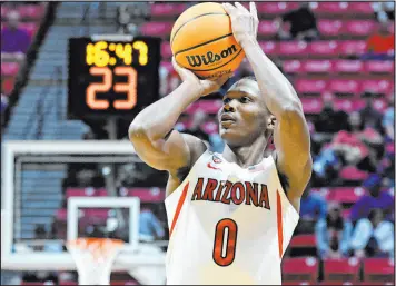  ?? Denis Poroy The Associated Press ?? Arizona guard Bennedict Mathurin shoots against Wright State in a firstround NCAA Tournament game in March. Mathurin is a lottery prospect and one of the top wings in this year’s NBA draft, to be held Thursday.