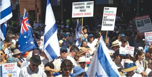  ?? (Lisa Maree Williams/Getty Images) ?? PEOPLE TAKE part in a ‘United With Israel – Bring Them Home’ protest in November in Sydney.