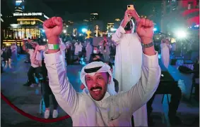  ?? KAMRAN JEBREILI/AP PHOTO ?? Emiratis celebrate Tuesday after the Amal, or Hope, Probe entered Mars orbit as a part of Emirates Mars mission, in Dubai, United Arab Emirates.
