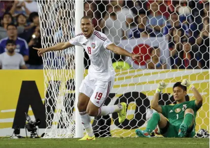  ?? Reuters ?? Ismail Ahmed, left, is one of the UAE’s veterans, along with Omar Abdulrahma­n and Ali Mabkhout, at the Gulf Cup