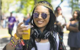  ?? Sarahbeth Maney / Special to the Chronicle 2018 ?? Thomas Keller, seen in the kitchen of his French Laundry restaurant, will host booths for Ad Hoc, Bouchon Bakery and La Calenda.
Rachel Leung of San Francisco drinks a beer at the 2018 BottleRock festival. This year’s brew offerings range from Lagunitas to Coors Light.