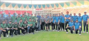  ?? UPCA ?? India Green (left) and India Blue (right) players pose with trophy in Lucknow on Friday.