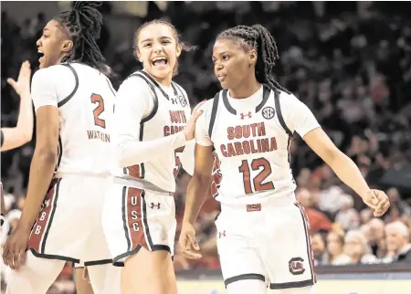  ?? SAM WOLFE Special To The State ?? South Carolina guard Milaysia Fulwiley (12) celebrates with teammates after scoring during the Gamecocks’ game against Kentucky at Colonial Life Arena in Columbia on Jan. 15.