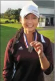  ?? GENE WALSH — DIGITAL FIRST MEDIA ?? Conestoga’s Samantha Yao smiles with her District 1 golf medal after winning the title Tuesday at Turtle Creek Golf Club in Limerick.