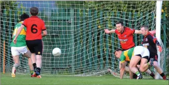  ??  ?? Conor Crawley’s knockdown is finished off by O’Mahony’s Ben McLaughlin for goal number three against Mattock Rangers.
