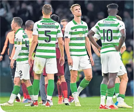  ??  ?? The Celtic players’ dejection is plain to see at the end of the Champions League qualifier against Cluj