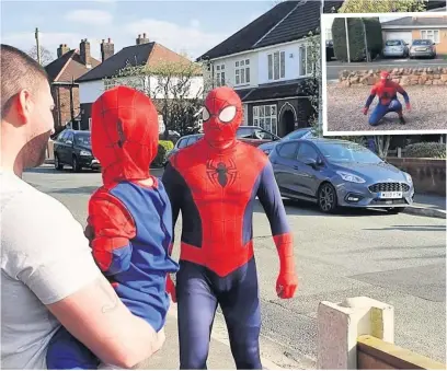  ??  ?? Jaguar Land Rover employee Neil Mercer raised more than £6,000 for frontline NHS staff by dressing up as Spider-Man to cheer up locals during lockdown