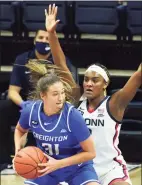  ?? David Butler II / USA TODAY ?? Creighton forward Emma Ronsiek (31) is defended by UConn’s Aaliyah Edwards (3) during a December game in Storrs.