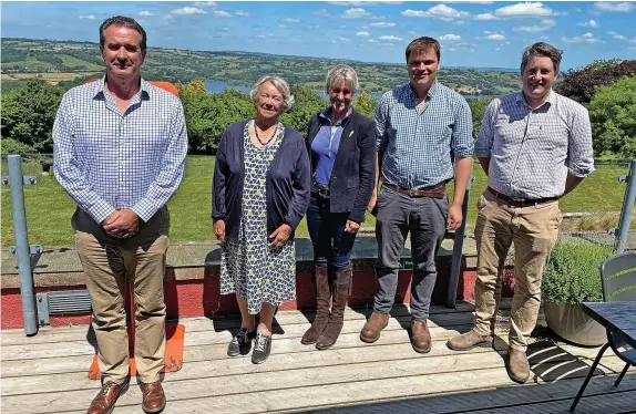  ?? Pictures: Yeo Valley ?? NFU president Minette Batters, centre, at Yeo Valley with the company’s representa­tives. Below, Ms Batters at Yeo Valley Organic’s agroforest­ry project