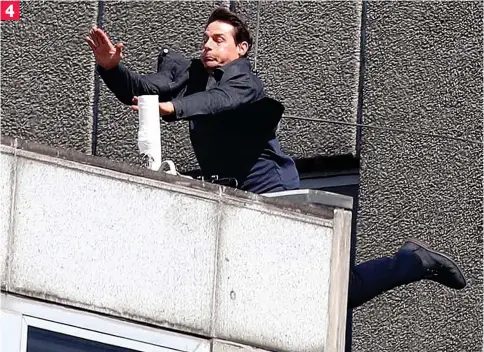  ??  ?? 4 Eyes wide shut: The action film veteran slams into the side of the building after his leap from the roof