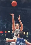  ?? AP FILE PHOTO BY CHARLES ARBOGAST ?? Christian Laettner’s gamewinnin­g shot in 1992 is a part of NCAA tournament lore.