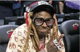  ?? DAVID SANTIAGO dsantiago@miamiheral­d.com, file 2019 ?? Rapper Lil Wayne faces up to 10 years in prison at a Jan. 28 sentencing hearing. Generally, sentencing guidelines range from one year to two years.