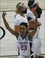  ?? ERIC GAY — THE ASSOCIATED PRES ?? Stanford’s Kiana Williams (23) and her teammates celebrate their win over Louisville on Tuesday night.