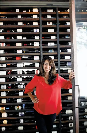  ?? Photos by Sarah Rice / Special to The Chronicle ?? Jannae Lizza, general manager and wine director of Passionfis­h in Pacific Grove, solicits input from her servers for a wine list far more diverse than many in Monterey County.