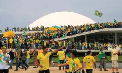  ?? Photograph: Sérgio Lima/ AFP/Getty Images ?? Supporters of Brazilian former President Jair Bolsonaro invade the National Congress in Brasília on 8 January.