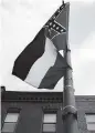  ?? PATRICK T. FALLON | AFP | TNS | File ?? The Mississipp­i state flag includes the Confederat­e battle emblem.