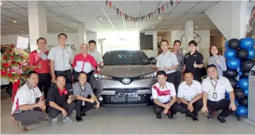  ??  ?? Sales advisors of Rimbunan Hijau Auto Services beside the all-new Toyota C-HR.