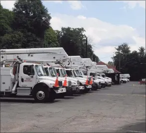  ?? Hearst Connecticu­t Media file photo ?? Utility trucks in Ridgefield.