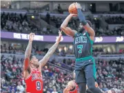  ?? AP ?? Celtics guard Jaylen Brown shoots as Bulls guard Antonio Blakeney defends.